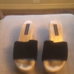 Black swade sandals by Steve Madden. 2/1/2 heel .